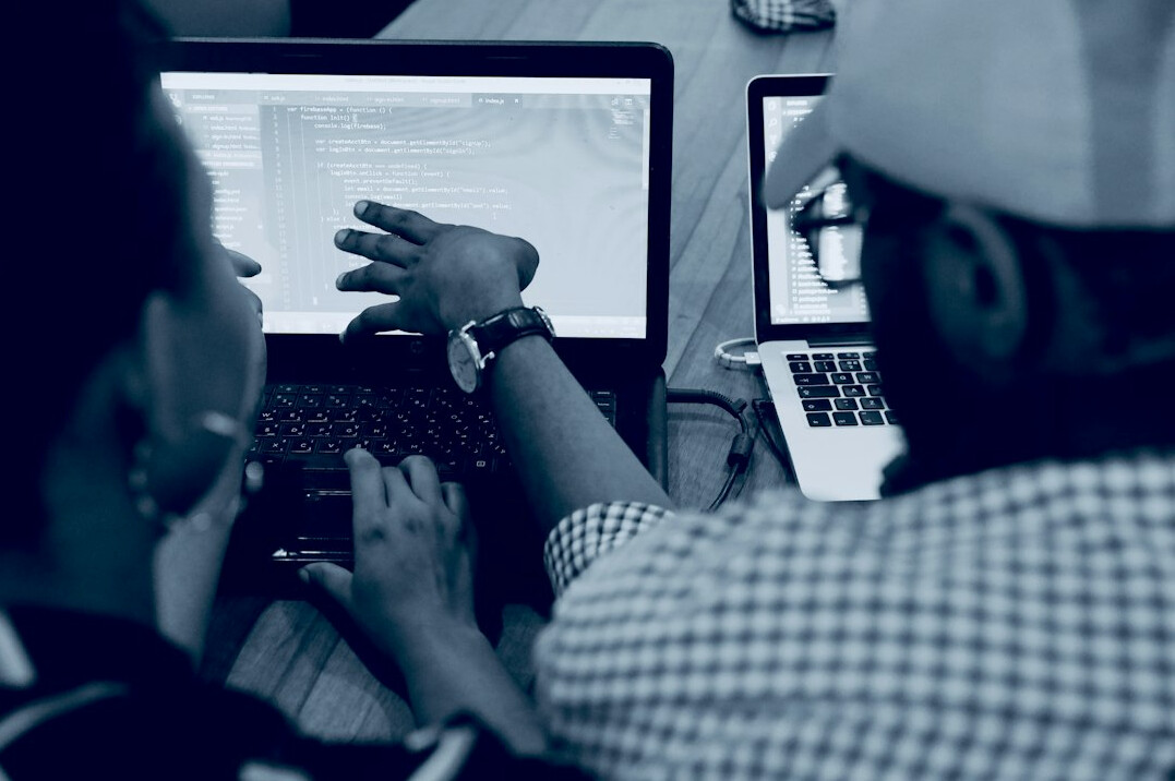 corporate team collaborating on code