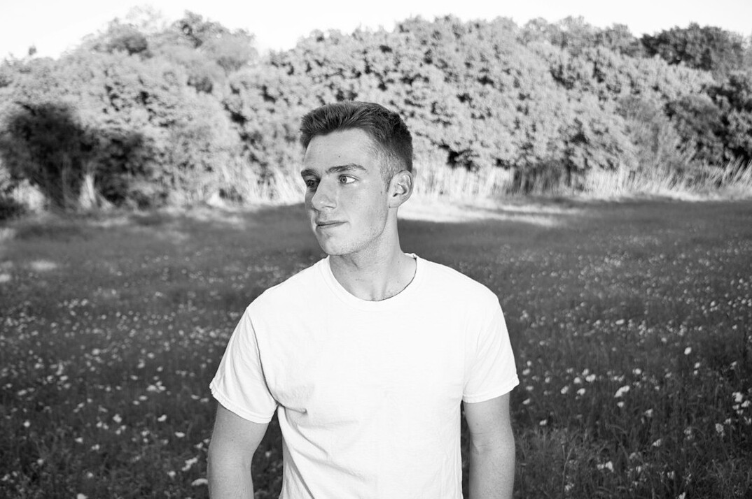 Portrait of a young man with short hair and a shirt